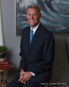 Dr. Markl Clymer in a blue suit